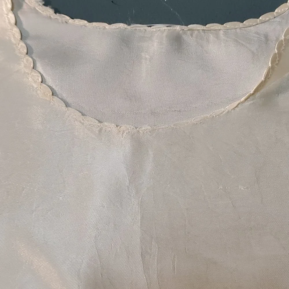 Vintage baby dress with jacket. Trimmed in lace with tie. The jacket has enbroid